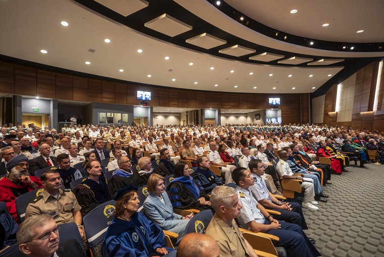 A full auditorium of people